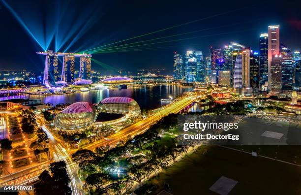 laser light show at marina bay - singapore night stock pictures, royalty-free photos & images