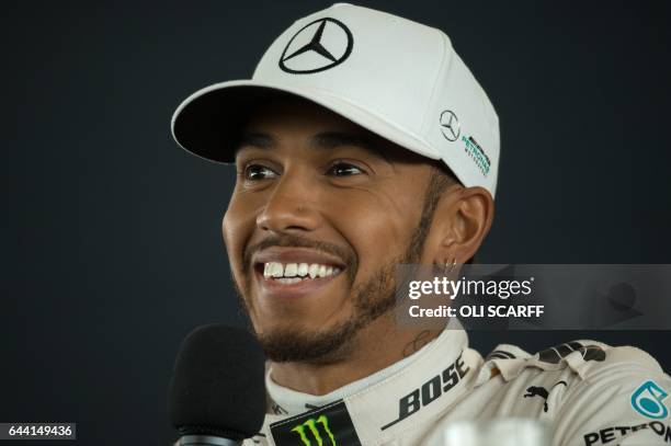 Mercedes AMG Petronas Formula One driver Britain's Lewis Hamilton speaks during a launch event for the Mercedes 2017 Formula one car at Silverstone...
