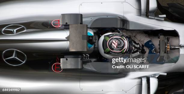 Mercedes AMG Petronas Formula One driver Finland's Valtteri Bottas drives during a launch event for the new 2017 season car at the Silverstone motor...