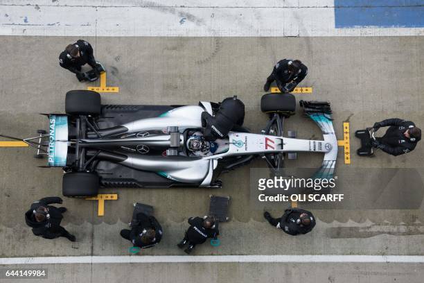 Mercedes AMG Petronas Formula One driver Finland's Valtteri Bottas drives during a launch event for the new 2017 season car at the Silverstone motor...