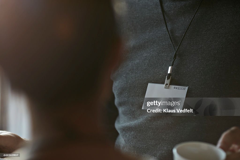 Close-up of name tag of businessman at conference