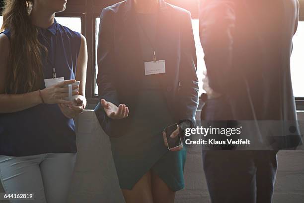 close-up of business people talking at conference - focagem difusa imagens e fotografias de stock