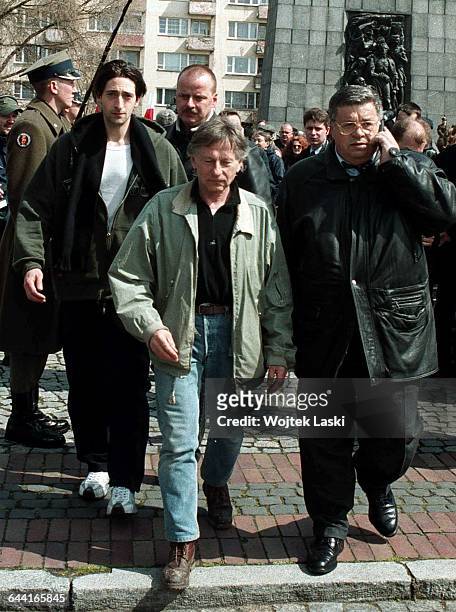 American actor Adrien Brody, Polish-French film director Roman Polanski and Polish film producer Lew Rywin lay flowers at the Monument to the Ghetto...