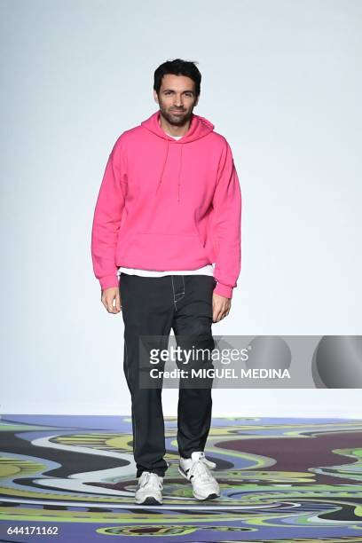 Designer Massimo Giorgetti greets the audience at the end of the show for fashion house Emilio Pucci during the Women's Fall/Winter 2017/2018 fashion...