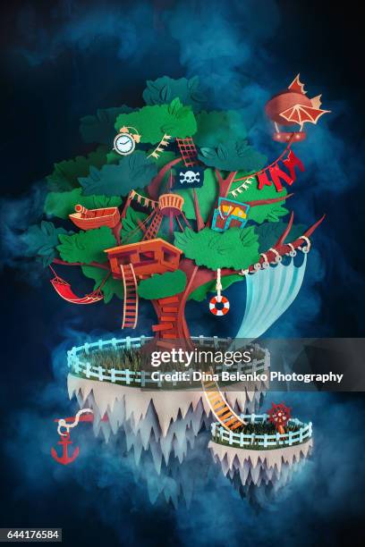 pirate treehouse on a floating island made from paper - neverland stock illustrations