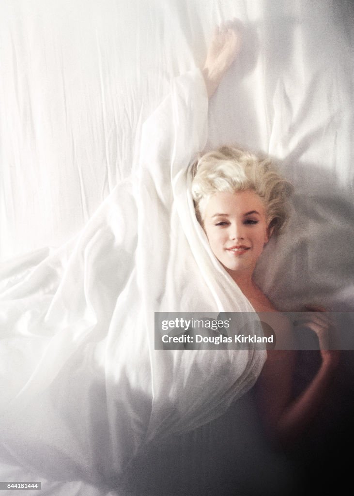 Marilyn Monroe On A White Bed