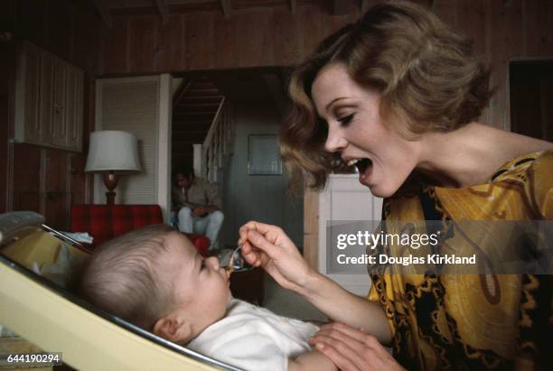 Jane Fonda Feeding her Daughter