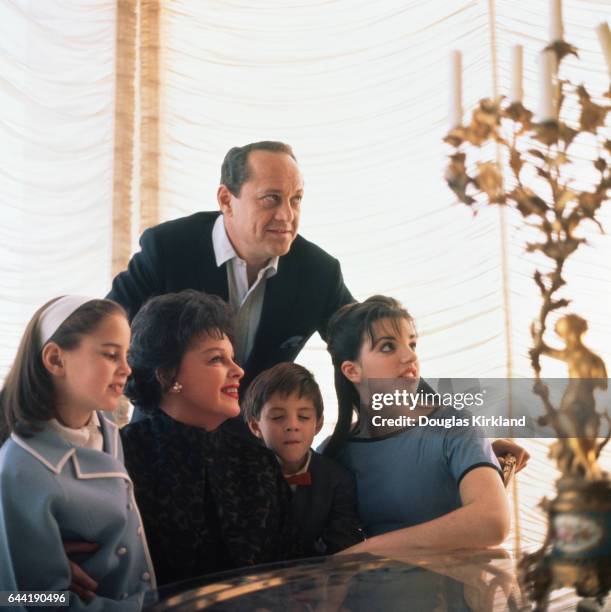 Judy Garland with her family. From left: Lorna Luft, Judy Garland, husband Sidney Luft , Joey Luft, and Liza Minnelli.