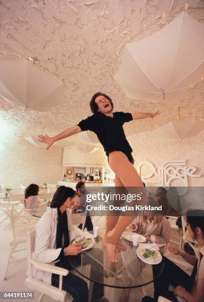 American fitness coach Richard Simmons Standing on a Table