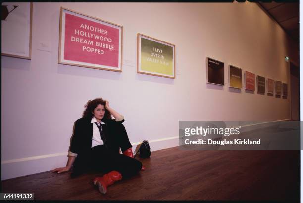 Lois Chiles Sitting Underneath Art Work