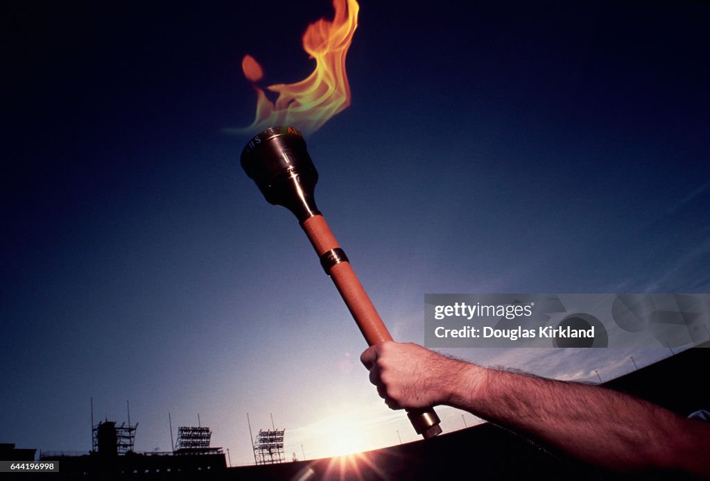 Hand Holding Olympic Torch