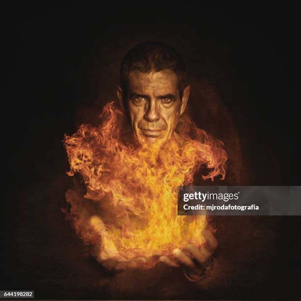 man of fire - mjrodafotografia stock pictures, royalty-free photos & images