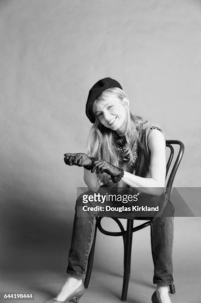 Actress Rebecca De Mornay wearing a beret and gloves and sitting on a chair in 1984. Rebecca De Mornay had just starred opposite Tom Cruise in the...