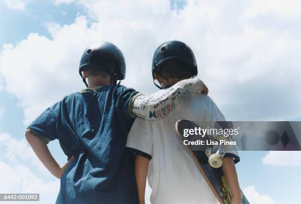 two young skateboarders - orthopedic cast stock pictures, royalty-free photos & images