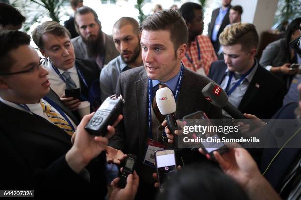 Reporters surround white supremacist Richard Spencer during the first day of the Conservative Political Action Conference at the Gaylord National...