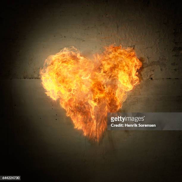 heart of flames - hearts on fire stock pictures, royalty-free photos & images