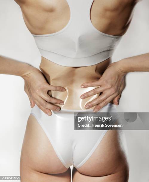 woman having back pain - arms akimbo stock pictures, royalty-free photos & images