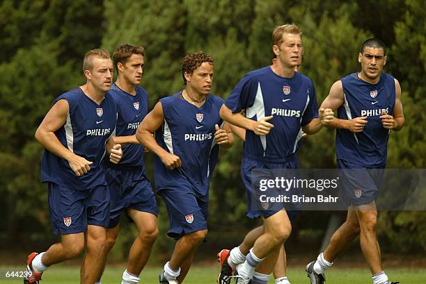 Clint Mathis, Josh Wolff, Cobi Jones, Gregg Berhalter, and Claudio Reyna of the U.S.A. Soccer team jog during a training session at the Misari...