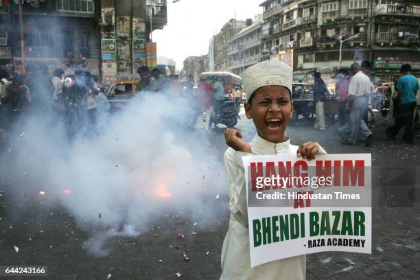 Judgement - An Indian Muslim child shouts anti-Pakistani slogans during a rally celebrating the sentencing of Mohammed Ajmal Amir Kasab in Mumbai -...