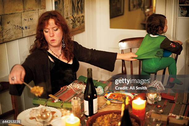 mother with daughter at dinner - busy mother stock pictures, royalty-free photos & images