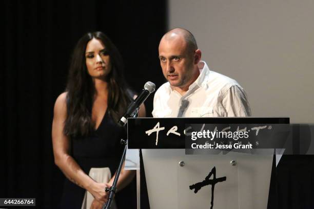 Executive producer Demi Lovato and director Shaul Schwarz introduce the film Beyond Silence during the premiere on February 22, 2017 in Los Angeles,...