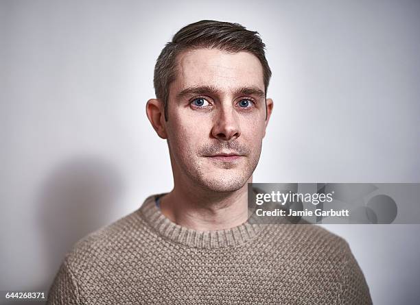 early 30's british male with a proud expression - serious stock pictures, royalty-free photos & images