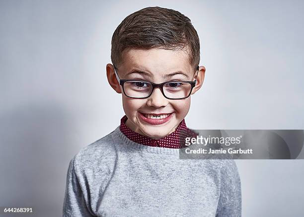 portrait of a british child pulling a face - newnaivetytrend stock-fotos und bilder