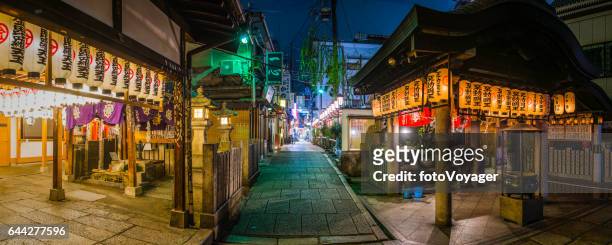japan quiet alleyways of osaka illuminated at night panorama - osaka shrine stock pictures, royalty-free photos & images