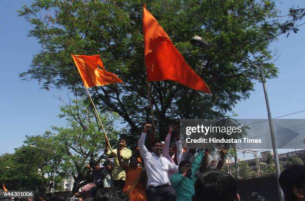 Shiv Sena workers celebrate after winning the BMC election at Dahisar on February 23, 2017 in Mumbai, India. The BJP has won 82 of the councils 227...