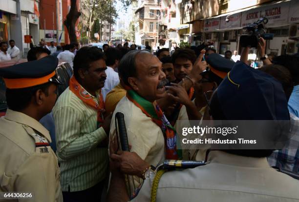 And Shiv Sena supporters clash outside BJP office at Dadar on February 23, 2017 in Mumbai, India. The BJP has won 82 of the councils 227 seats and...