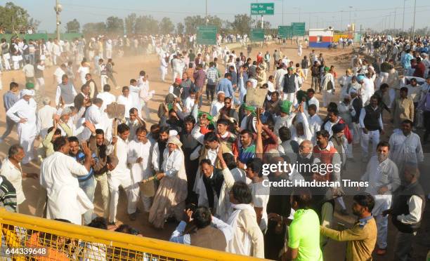 Indian National Lok Dal activists protesting over the Satluj-Yamuna Link canal issue at Shambhu border on February 23, 2017 in Patiala, India. Top...