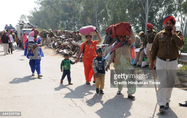 People on their way by foot after National Highway closed due to tension mounted between Punjab and Haryana over the Satluj-Yamuna Link canal issue...