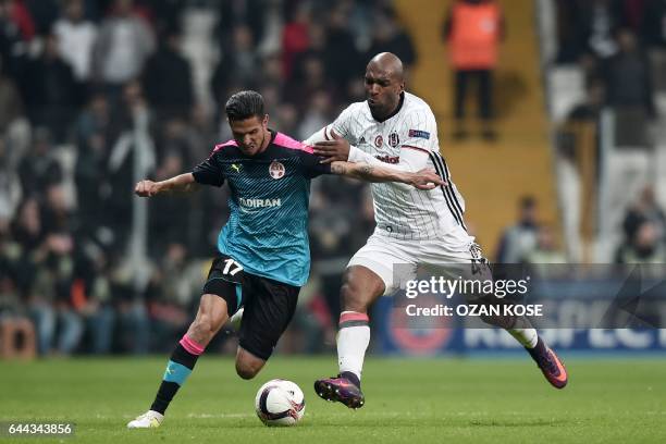 Hapoel Beersheva's Matan Ohayon outruns Besiktas' Dutch midfielder Ryan Babel during the UEFA Europa League football match Besiktas vs Hapoel...