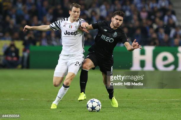 Stephan Lichsteiner competes with Ruben Neves for the ball during the Champions League match between FC Porto and Juventus at Dragon Stadium on...