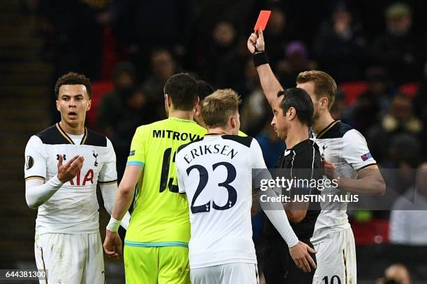 Portuguese referee Jorge Sousa shows a straight red card to send off Tottenham Hotspur's English midfielder Dele Alli during the UEFA Europa League...