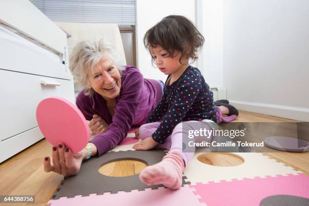 three generation mixed race family - beautiful grandmothers stock-fotos und bilder