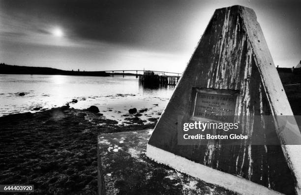 The sun rises on the eastern most US town, Lubec, Maine, right which sits across the Lubec Narrows from Campobello Island, New Brunswick, left,...