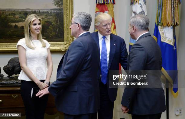 President Donald Trump, center, and his daughter Ivanka Trump, right, greet attendees before a listening session on domestic and international human...
