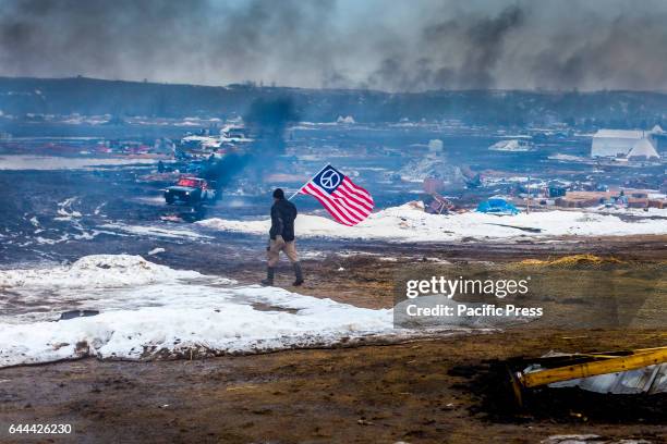 Defiant Dakota Access Pipeline water protectors faced-off with various law enforcement agencies on the day the camp was slated to be raided. Many...