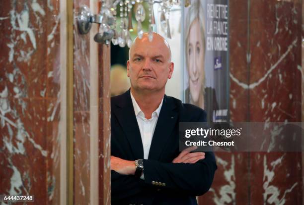 Thierry Legier a bodyguard to French far-right political party National Front leader Marine Le Pen stands guard, during a press conference focused on...