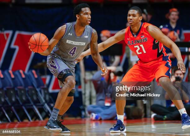 Vic Law of the Northwestern Wildcats dribbles the ball against Malcolm Hill of the Illinois Fighting Illini at State Farm Center on February 21, 2017...