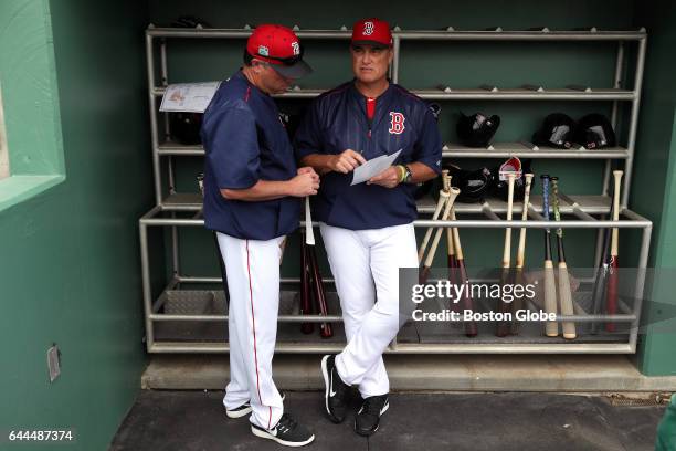 Boston Red Sox manager John Farrell is pictured with Boston Red Sox Bench Coach Gary DiSarcina in the Sox dugout before the start of the day's game...