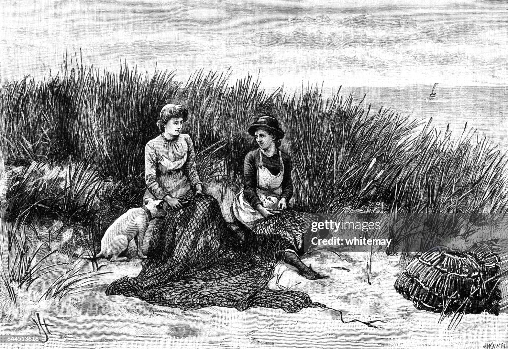 Fisher girls mending a net in the sand dunes