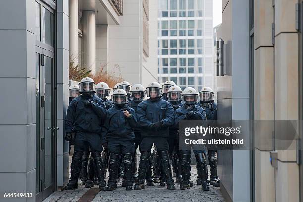 Police cordon in a demonstration against austerity and capitalism on the day of the opening of the new ECB, European Central Bank headquarter...