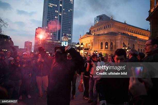 Protester of the Blockupy anti-capitalist movement with fireworks in a demonstration against austerity and capitalism on the day of the opening of...