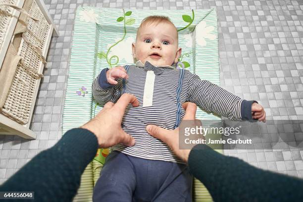 pov of child on a changing mat - newnaivetytrend ストックフォトと画像