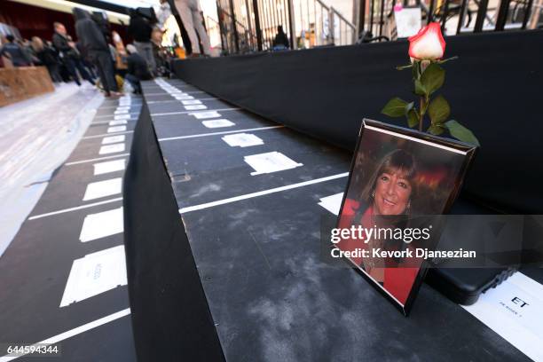 Rose and a photograph are placed on the red carpet press risers in memory of Bonnie Tiegel, Entertainment Tonight Senior Producer who passed on...