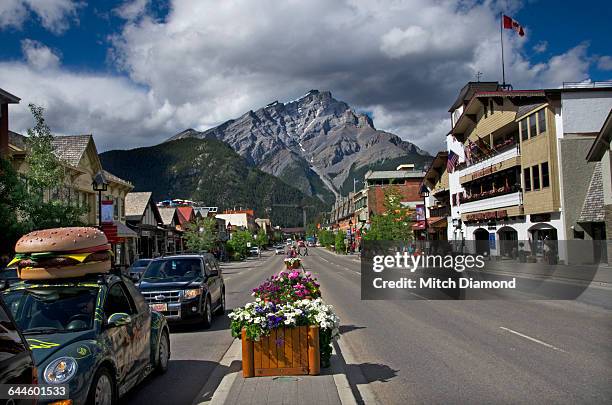 downtown banff in alberta, canada - alberta city stock pictures, royalty-free photos & images