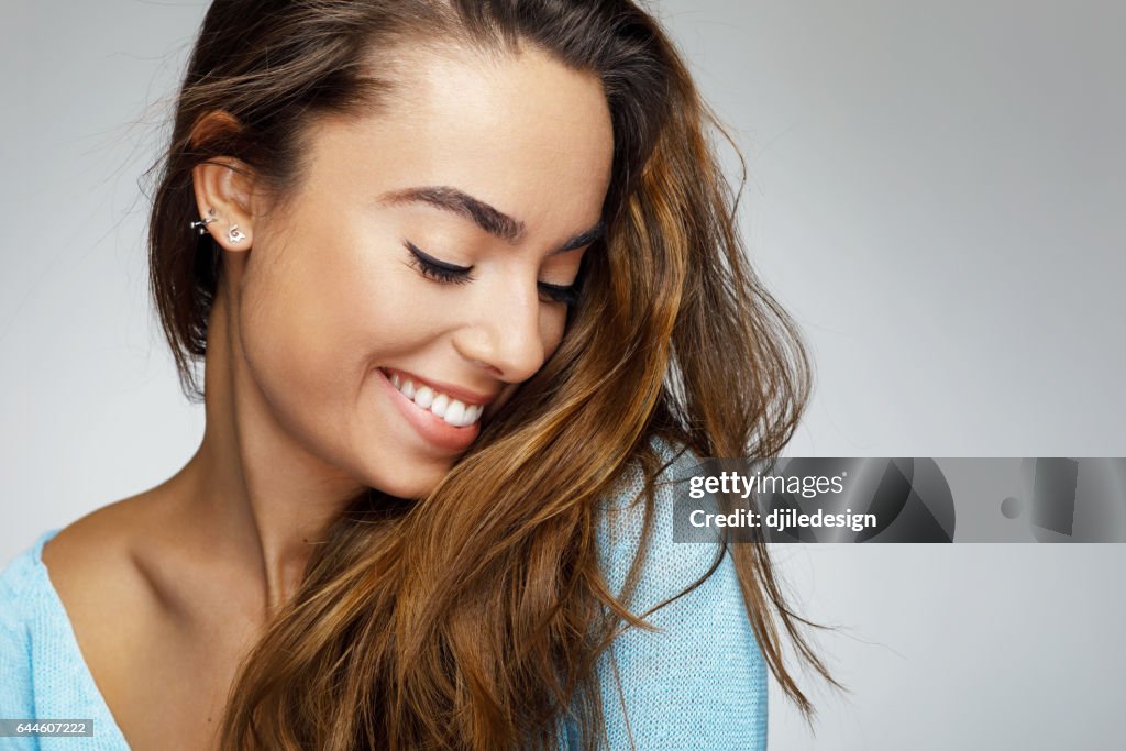 Portrait of a young woman with a beautiful smile