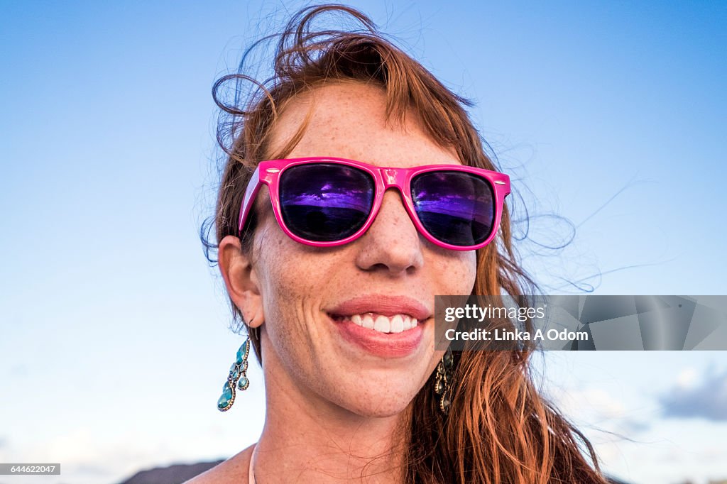 Girl Smiling with Pink Sunglasses